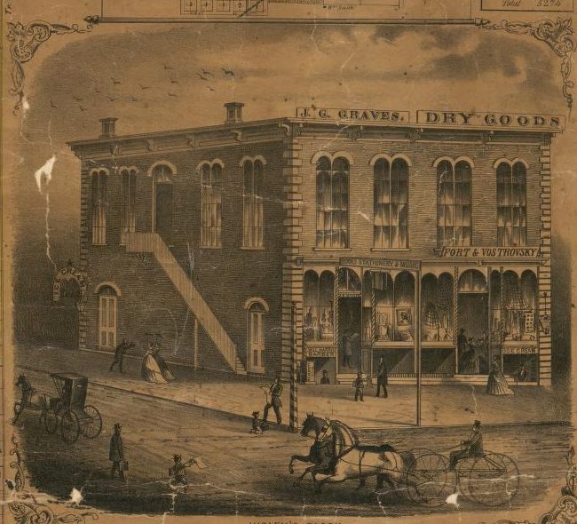 An engraving of a three-story brick store building with a dry goods sign and horse-drawn wagons
